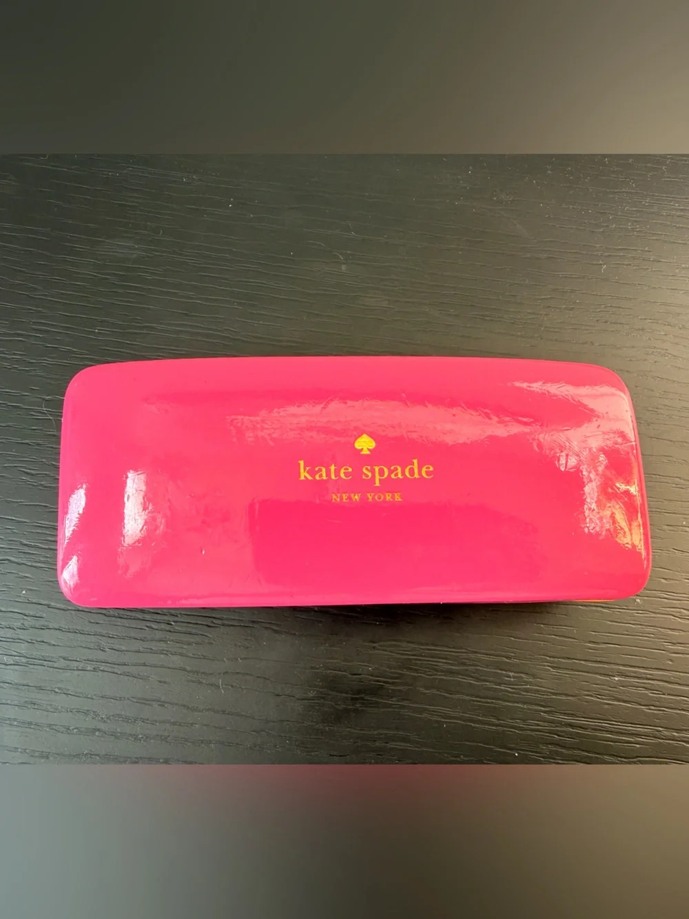 kate spade bright pink glossy toiletry/accessory case with gold logo